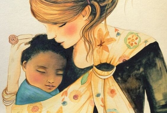 Une maman embrasse son bébé